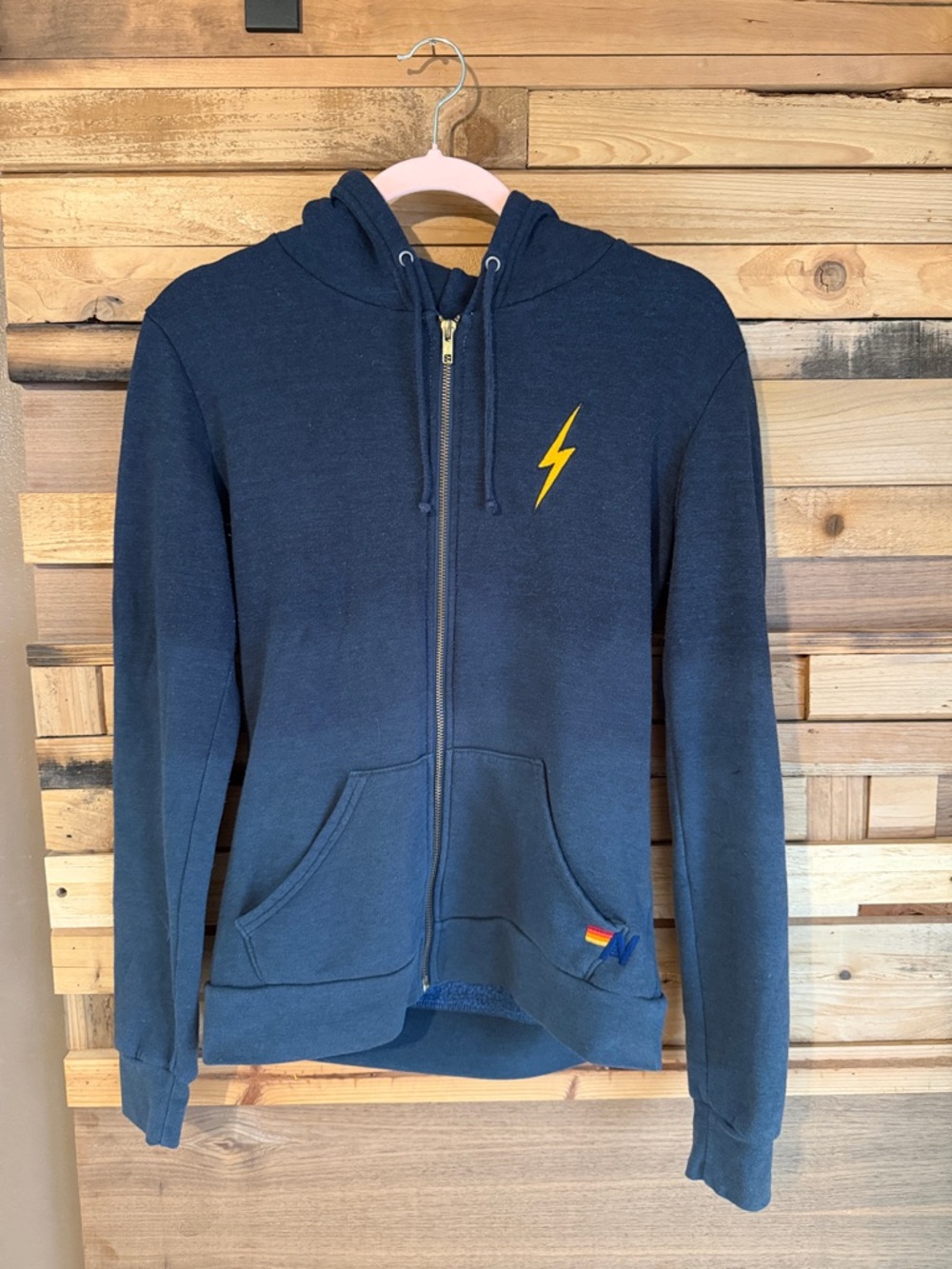 AVIATOR NATION Navy Zip-Up Hoodie with Yellow Lightning bolt.